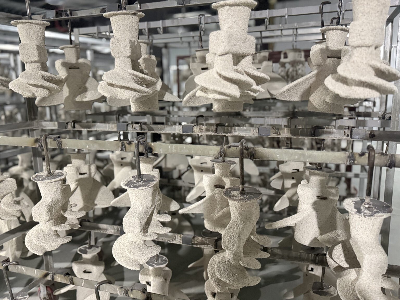 Ceramic propeller shells arranged for process review at Xspeed Marine factory