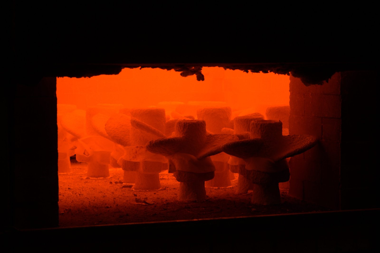 Ceramic shell molds during wax burnout at Xspeed Marine casting factory